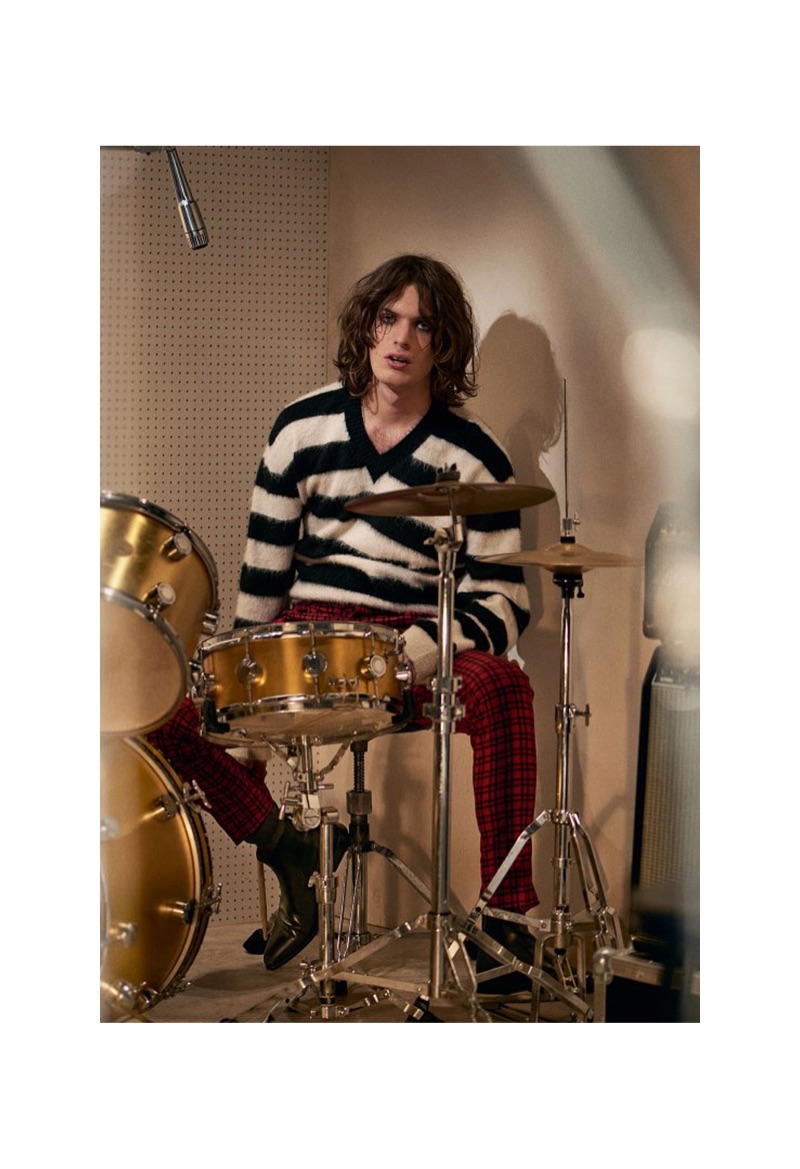 Lorenzo wears LANVIN sweater £630; GIVENCHY trousers from a selection