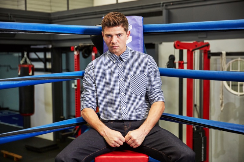 Luke Campbell rocks a checked shirt with dark rinse denim jeans by Ben Sherman.