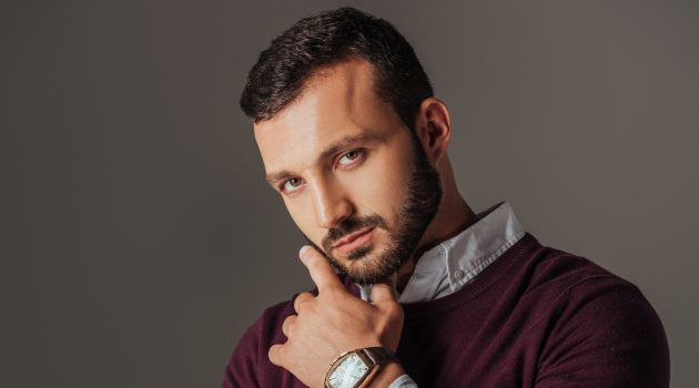8 Reasons Why Every Man Needs to Wear a Wristwatch Man Burgundy Sweater Wearing Watch