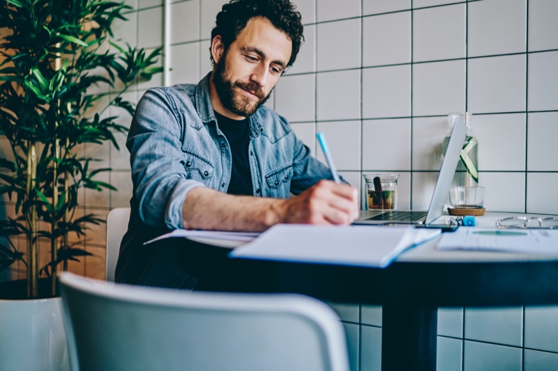 Man Taking Notes