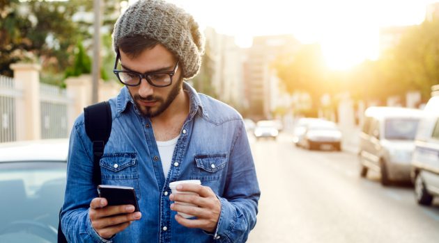 10 Top Men's Instagram Accounts You Should Follow Man on Phone