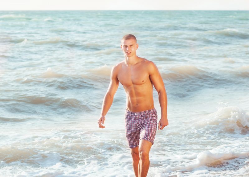 Man with Tan Swim Shorts Beach