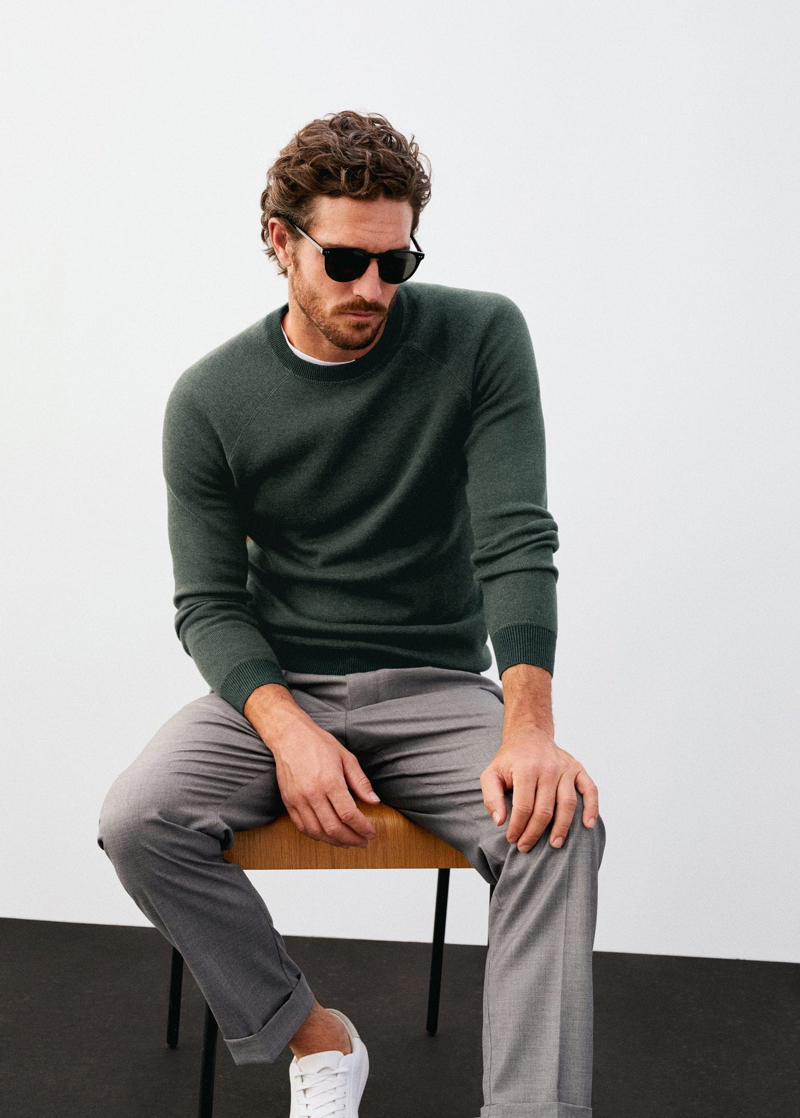 A smart vision, Justin Joslin wears a sweater with pleated trousers by Mango.