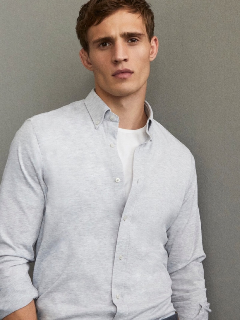 Julian Schneyder wears a smart shirt from Massimo Dutti's Travel Soft collection.