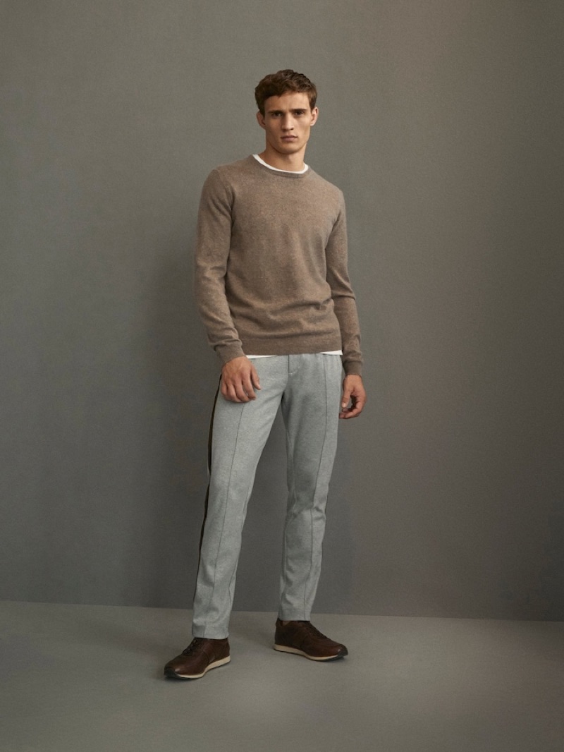 Front and center, Julian Schneyder dons an ensemble from Massimo Dutti's Travel Soft collection.