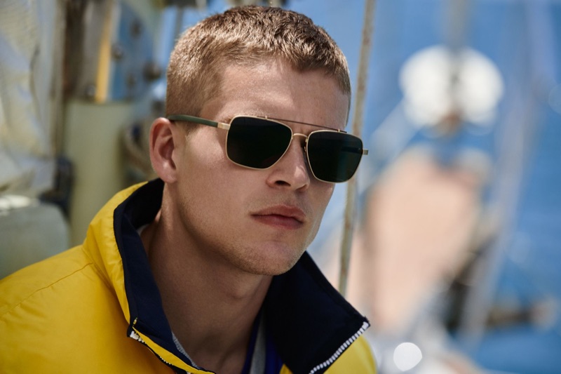 Rocking shades and a yellow jacket, Mitchell Slaggert stars in Nautica's fall 2019 campaign.