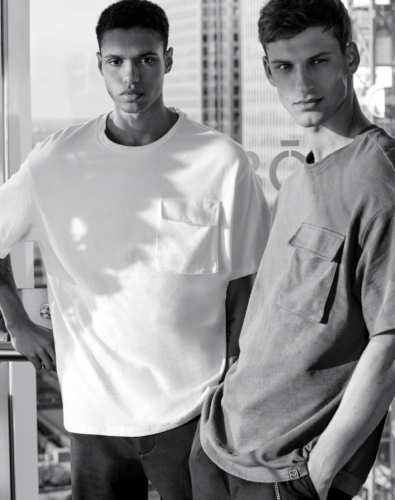 Donning oversized pocket tees, Gilbert Van Damme and David Trulik model Pull & Bear's urban collection. 