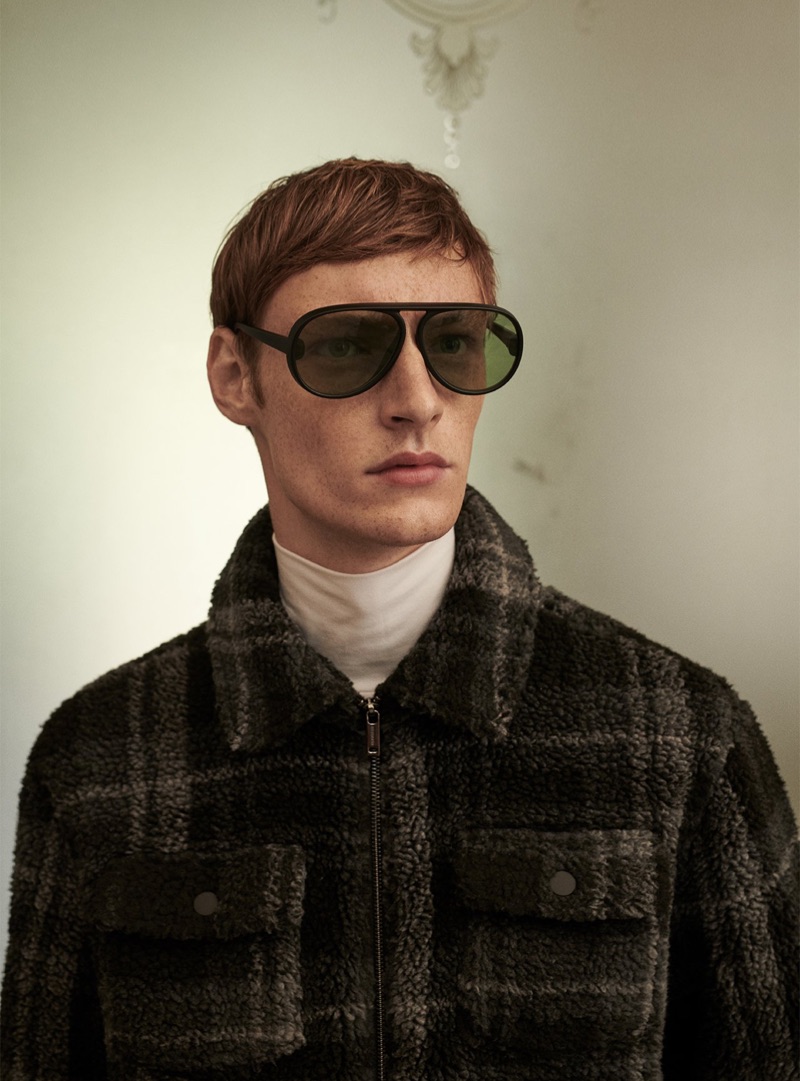 A sleek vision, Roberto Sipos sports a checked jacket from Reserved.