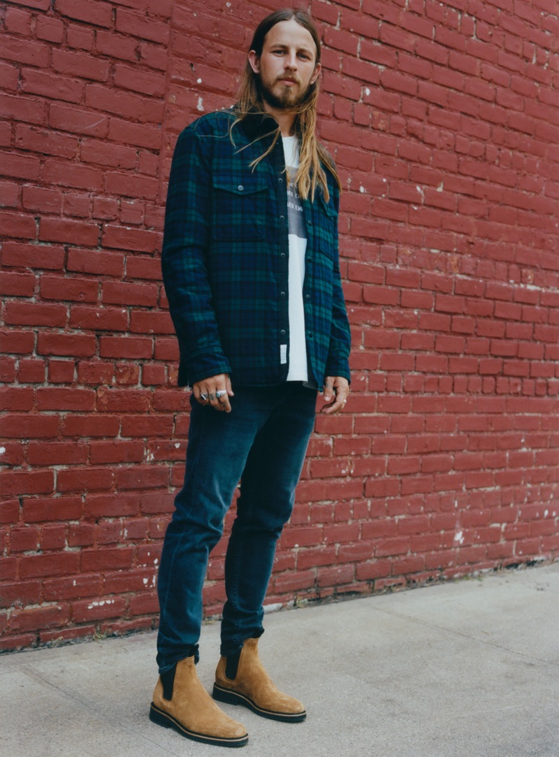 Riley Hawk sports a padded plaid shirt $495 with jeans and golden brown Chelsea boots $495 from Rag & Bone.