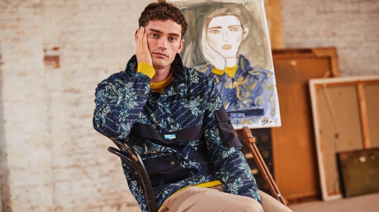Wearing Scotch & Soda, Harrison Alexander Griffiths poses with an illustration by Blair Breitenstein.