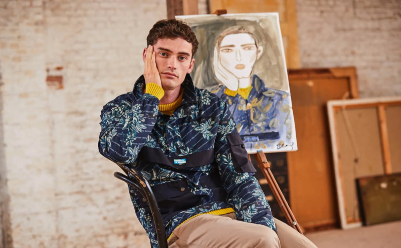 Wearing Scotch & Soda, Harrison Alexander Griffiths poses with an illustration by Blair Breitenstein.