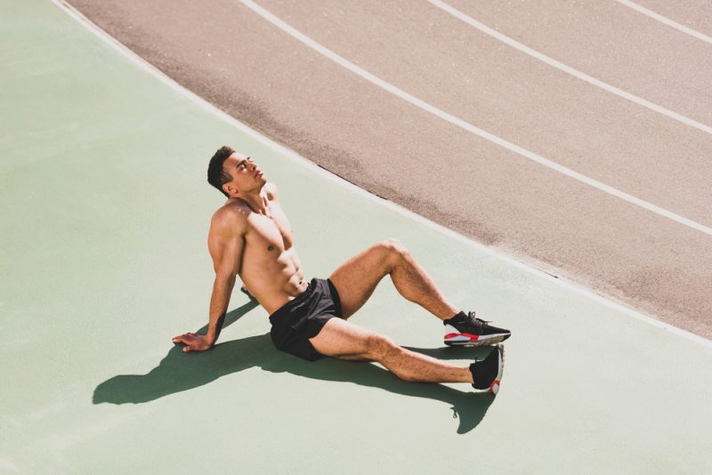 Shirtless Man Running Shorts Sneakers