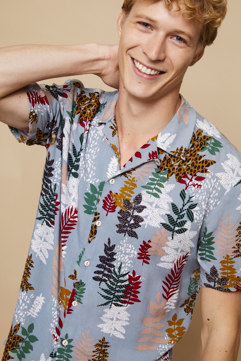 All smiles, Sven de Vries models a printed shirt from Basement.