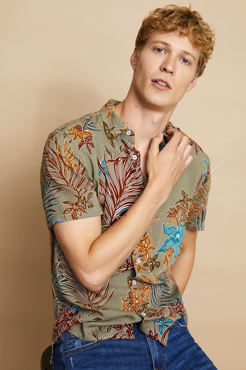 Sven de Vries sports a tropical print shirt and jeans from Basement.