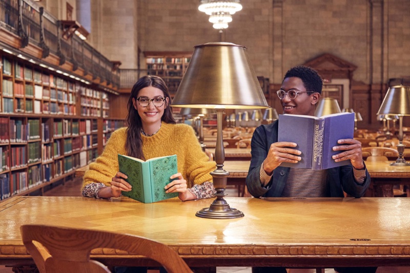 All smiles, Hamid Onifade dons Warby Parker's Farris glasses in Crystal. 