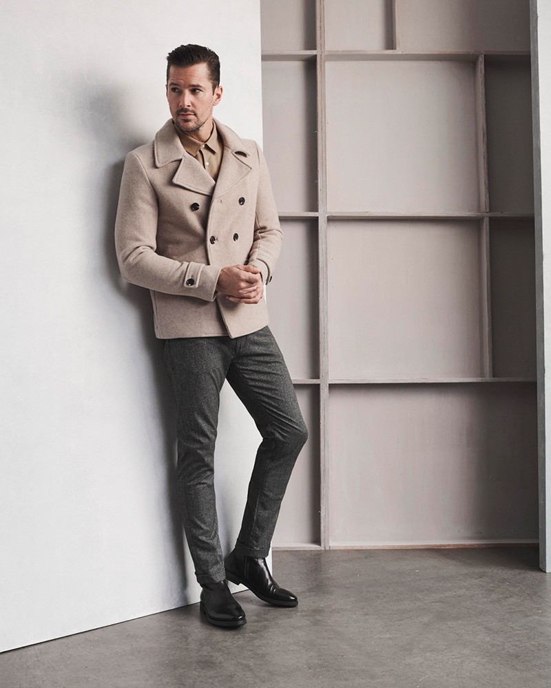 Model Andrew Shaw wears 34 Heritage's Cool mid-rise, slim leg grey checked pants.