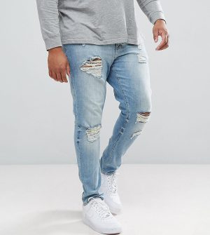 ASOS DESIGN Plus skinny jeans in light wash with heavy rips - Blue ASOS DESIGN Plus skinny jeans in light wash with heavy rips - Blue