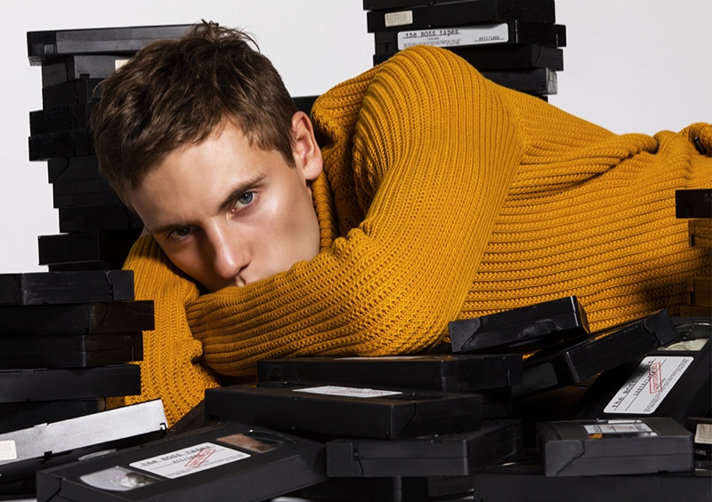Embracing a pop of color, Anton wears a ribbed sweater from BOSS.