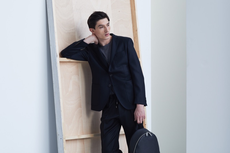 Jester White poses in a black suit from BOSS' Traceable Wool men's capsule collection.