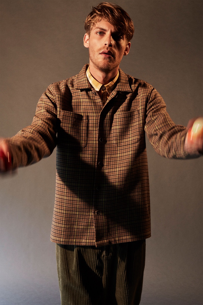 Front and center, Baptiste Radufe dons a checked overshirt with corduroy pants by Zara.