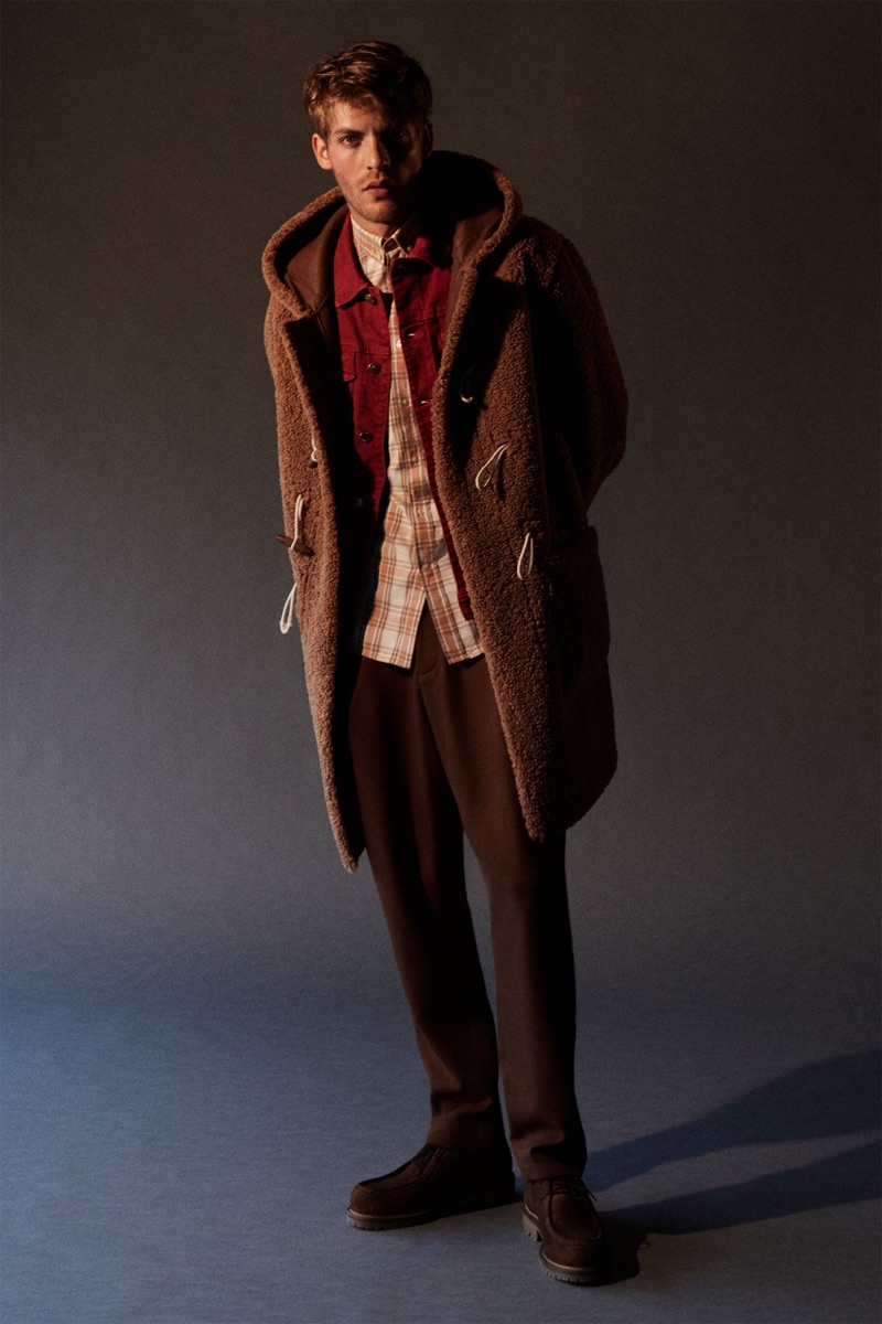 Taking to the studio, Baptiste Radufe models fall fashions from Zara.