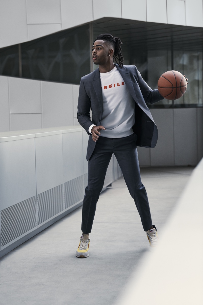 Connecting with Bloomingdale's, D'Angelo Russell wears a Theory suit with an A.P.C. graphic sweatshirt.