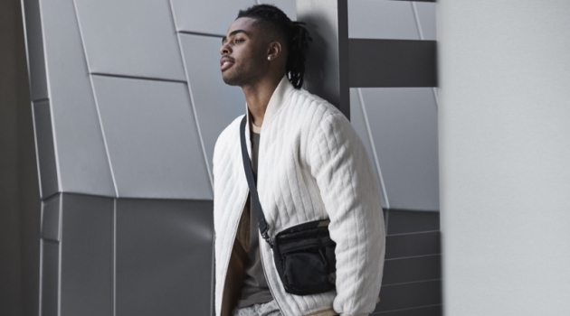 D'Angelo Russell Inspires in Bloomingdale's Mix Masters Fall '19 Campaign Starring in Bloomingdale's Mix Masters fall 2019 campaign, D'Angelo Russell sports a Helmut Lang fleece bomber jacket and t-shirt. He also rocks J Brand cargo pants in a camouflage print with Salvatore Ferragamo sneakers and a Porter sling bag.