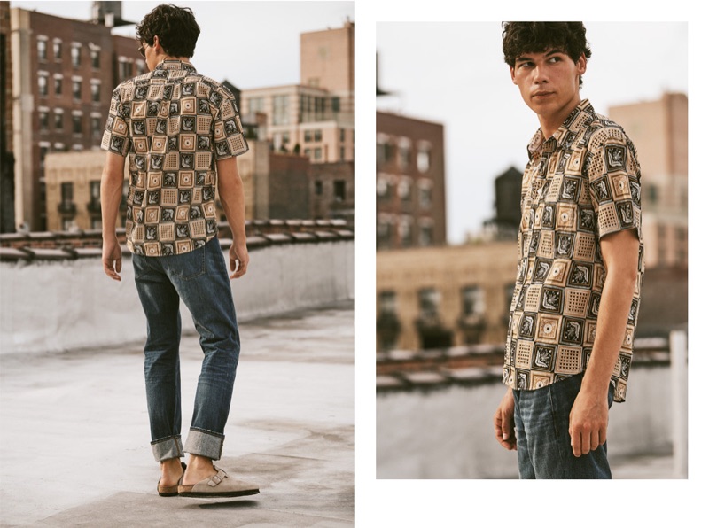 Model Tyler Blue Golden dons a Billy Reid short-sleeve shirt, Madewell rigid jeans, Birkenstock clogs, and Oliver Peoples Emet sunglasses.