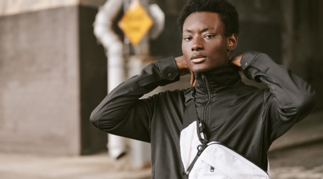 Youssouf 'Sets the Pace' in Y-3 for East Dane Reuniting with East Dane, Youssouf Bamba sports a Y-3 track jacket, cropped pants, and sling bag.