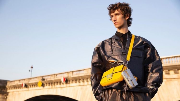 Etienne de Testa sports Fendi's leather Baguette bag in yellow.