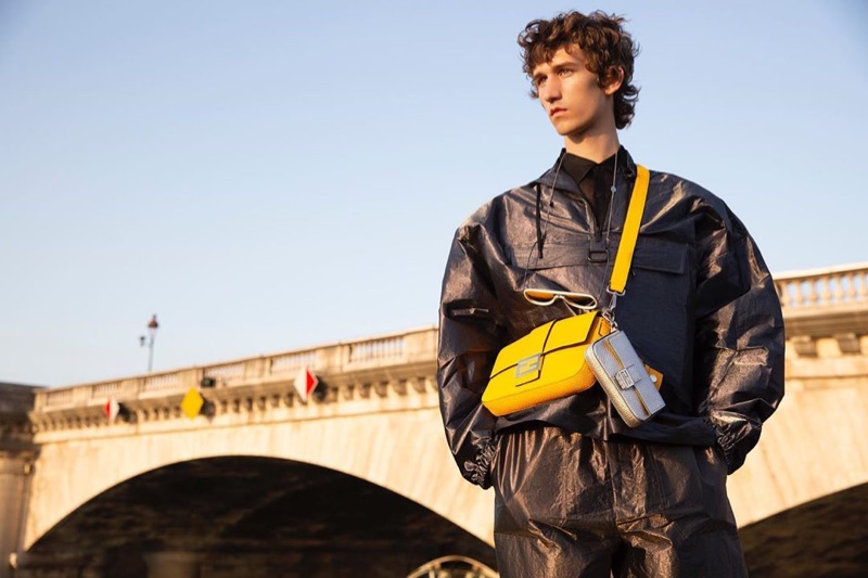 Etienne de Testa sports Fendi's leather Baguette bag in yellow. 