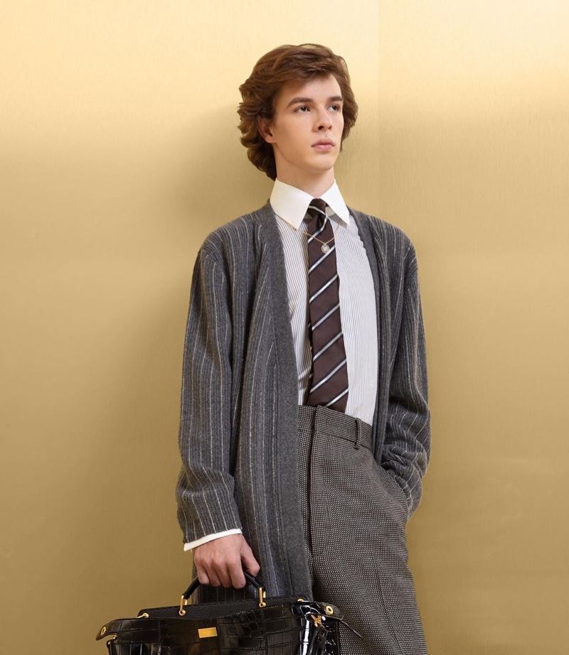 Efraim Schröder dons a grey tailored look with a cardigan from Fendi's fall-winter 2019 collection.