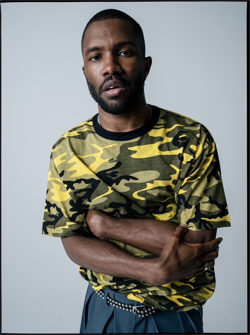 Front and center, Frank Ocean wears his own camouflage print t-shirt with a Louis Vuitton shorts skirt and vintage belt.