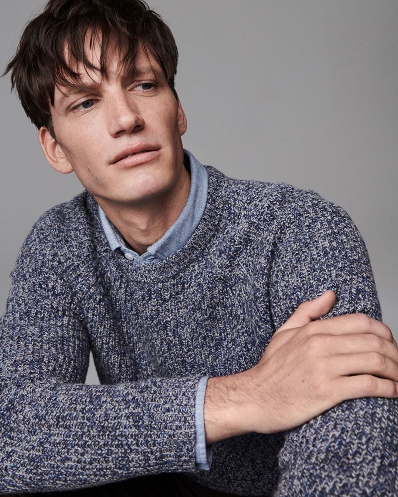 Florian Van Bael dons a smart shirt and sweater from Jigsaw's fall-winter 2019 men's collection.