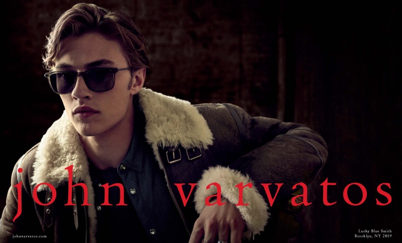 Rocking sunglasses and a brown shearling jacket, Lucky Blue Smith stars in John Varvatos' fall-winter 2019 campaign.