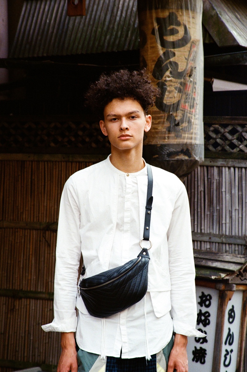 Kai wears shirt Joe Chia and belt bag Rebecca Minkoff.