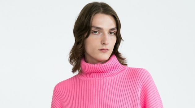 Block Party: Alex Rocks Colorful Fashions for Luisaviaroma Alex Rychkov sports a pink ribbed Balenciaga turtleneck sweater $1290 and Versace jeans $525.