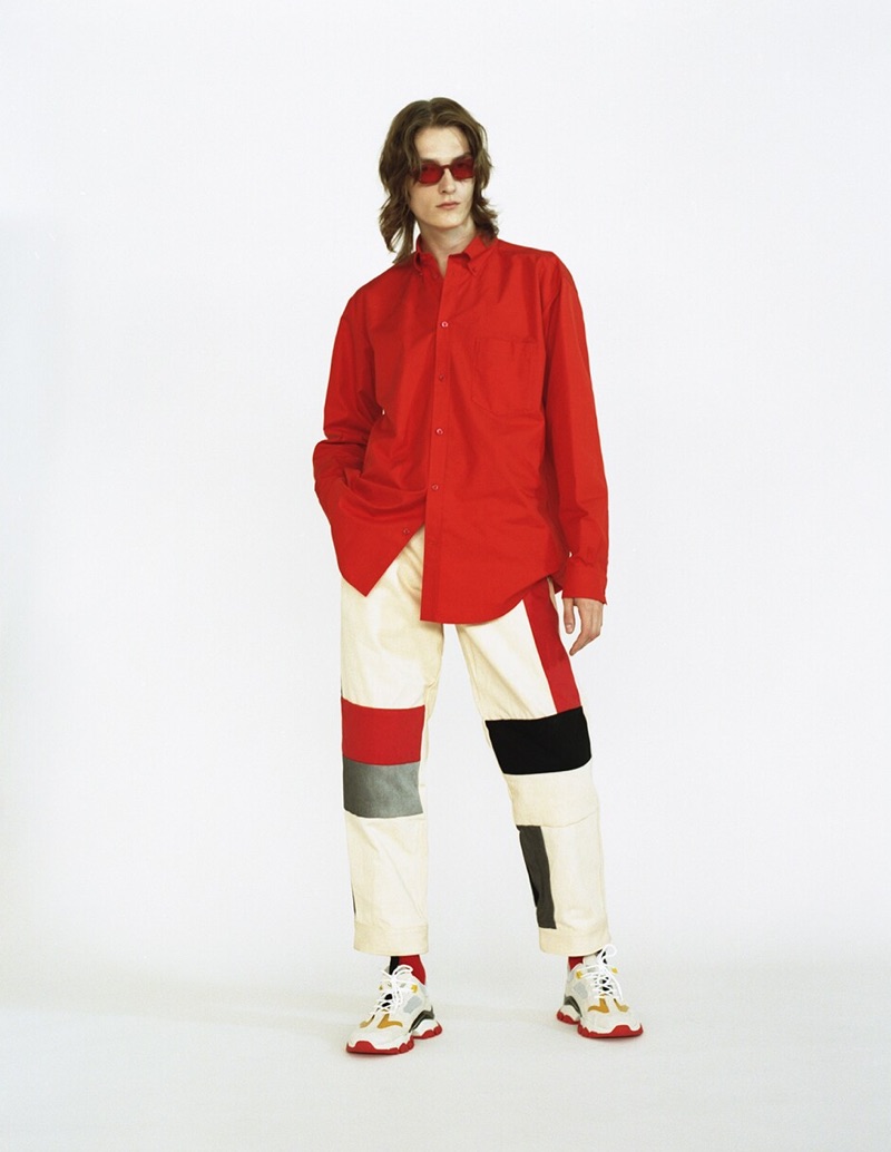 Front and center, Alex Rychkov wears red Chimi sunglasses $149, a Balenciaga shirt $895, GR Uniforma x Diesel Red Tag patchwork pants $625 and Moncler sneakers $665.