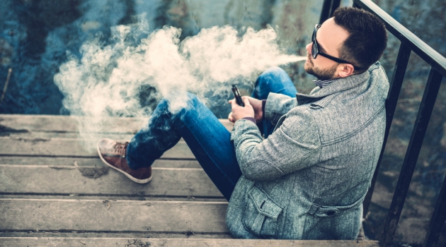 Smoking & Vaping in Public Man Vaping Outdoors in Sunglasses