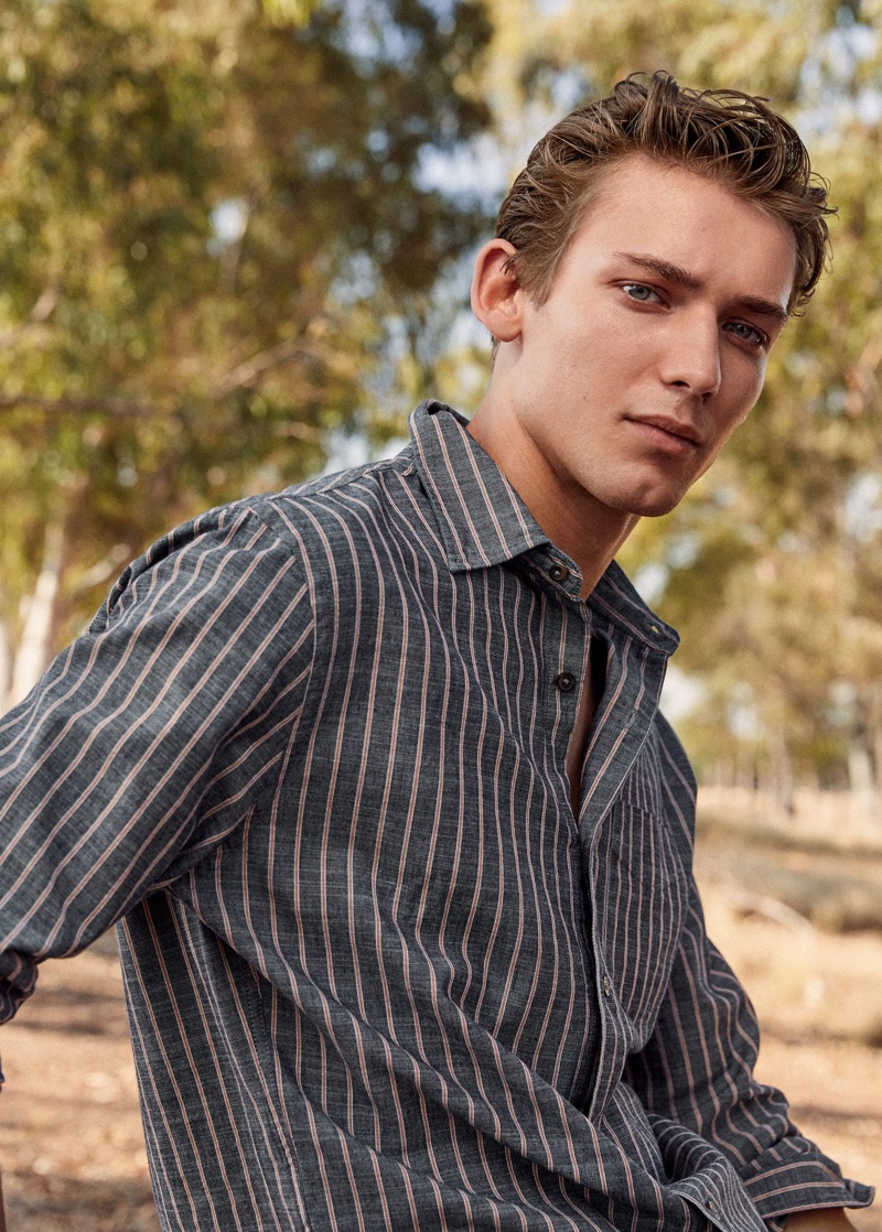 Donning a striped shirt, Christopher Einla sports Mango.