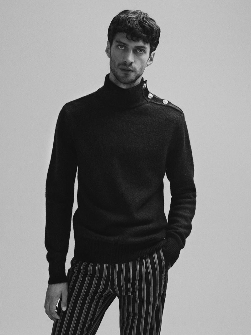 Front and center, Matthew Bell dons a turtleneck sweater with striped chinos $145 from Scotch & Soda.