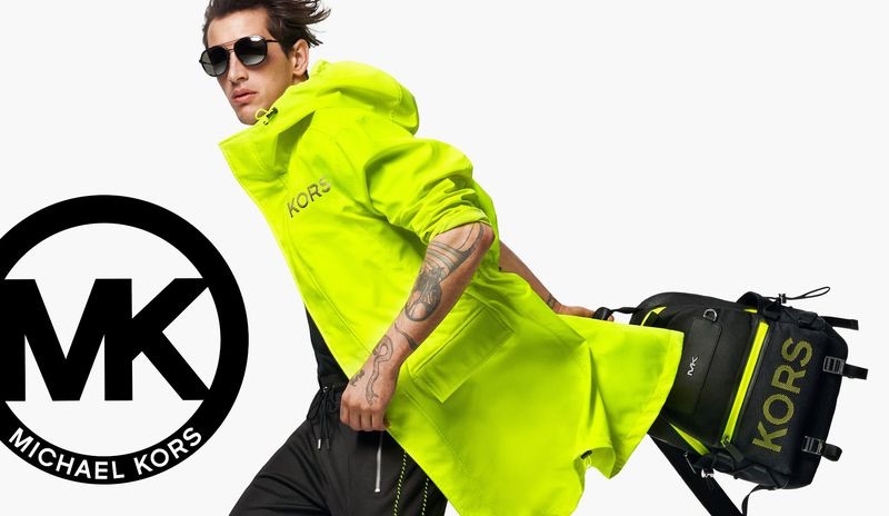 Embracing a bold splash of color, Austin Augie stars in Michael Kors' summer 2019 campaign.