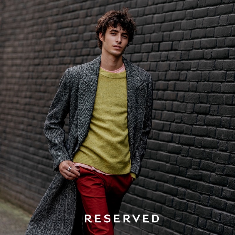 Mixing a wardrobe of rich colors, Oscar Kindelan models a fall look by Reserved.