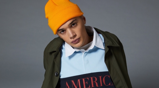 Perry Ellis America Capsule 3 Launches at Urban Outfitters Taking to the studio, Lancelot Prat sports a Perry Ellis logo rugby shirt.
