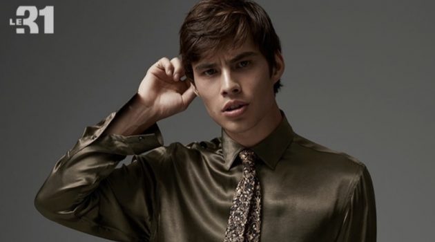 Baroque Decadence: Louis Baines Dons Bold Style for Simons Front and center, Louis Baines dons a LE 31 satiny shirt, gold leaf tie, and anti-fit trousers.