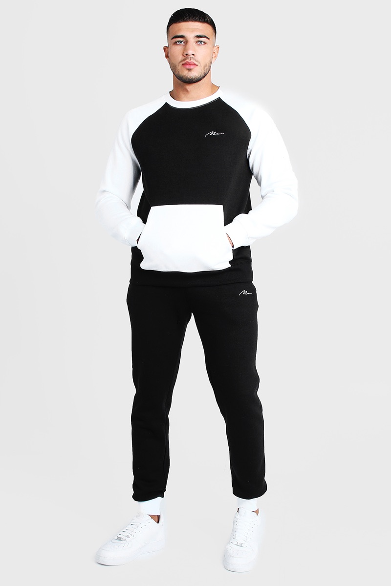 Wearing black and white, Tommy Fury goes sporty in a look from BOOHOOMAN.