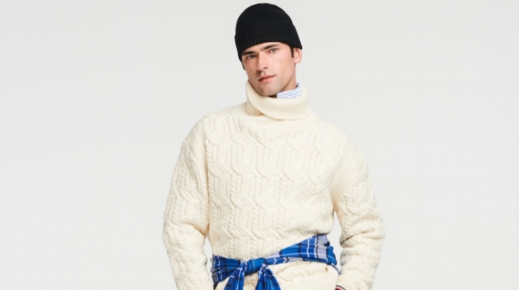 A chic but sporty vision, Sean O'Pry rocks a Tommy Hilfiger cable-knit turtleneck sweater with stretch pants.