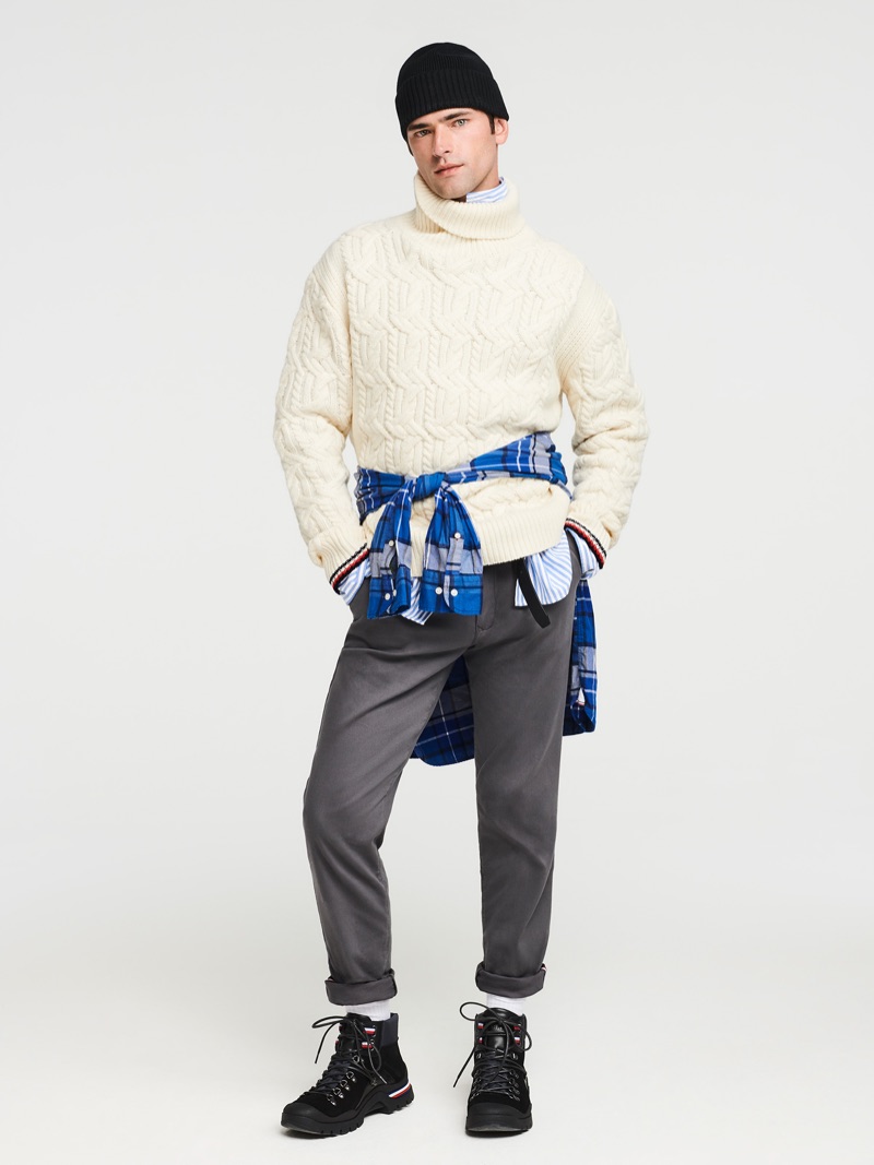 A chic but sporty vision, Sean O'Pry rocks a Tommy Hilfiger cable-knit turtleneck sweater with stretch pants.