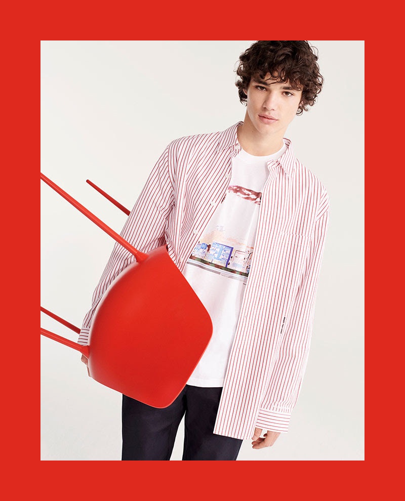 Connecting with YOOX, Fernando Lindez wears a red and white striped shirt with a graphic tee.