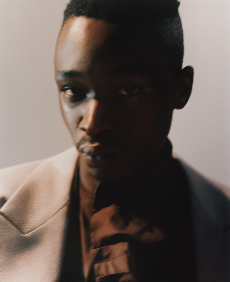 Front and center, Ashton Sanders sports a Raf Simons blazer with a Bianca Saunders shirt.